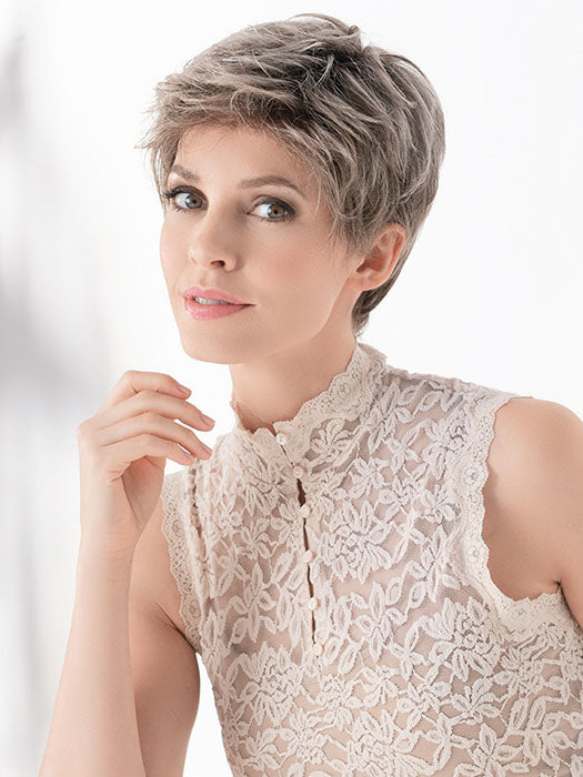 This short synthetic style has an extended lace front, which gives the appearance of a beautifully natural hairline